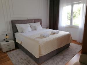 Postel nebo postele na pokoji v ubytování Green Park Apartments