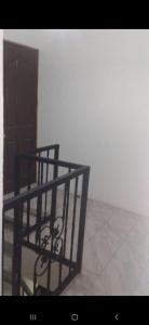 a room with a black railing on the floor at S&M Apartments and rooms in San José