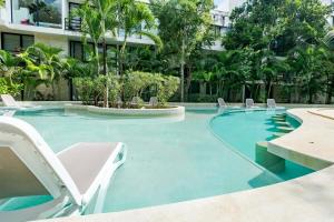 アクマルにあるLUXE 1-BR Condo in Bahia Principe - Multiple Poolsのギャラリーの写真