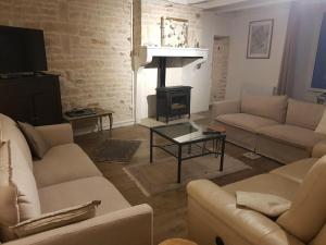 A seating area at Appealing holiday home in Loubigné with private pool