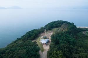 an aerial view of an island in the water at 千年オリーブテラス for your wellness 「The STAY」 in Tonosho