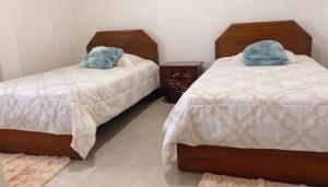 Una cama o camas en una habitación de La Cabaña Atardeceres Mágicos
