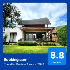 a house with a sign that says travel review awards at Villa Vimala Hills Semeru in Bogor
