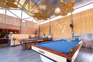 a billiard room with two pool tables in it at Nine Homestay in Can Tho