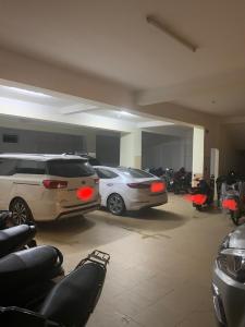 a parking lot with cars parked in a garage at Khách sạn lê lợi in Quang Ngai