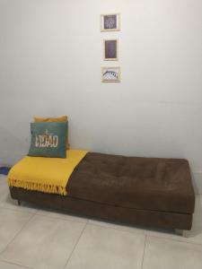 a large bed with a pillow on top of it at Hostel 940 in Sinop