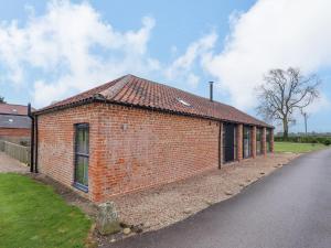 a brick building on the side of a road at Little Owl in Market Rasen