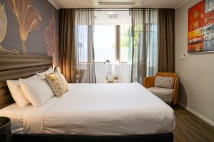 Postel nebo postele na pokoji v ubytování 57Hotel