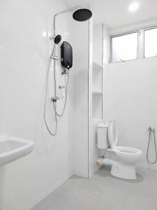 a white bathroom with a shower and a toilet at 13Pax -2 Storey Bayu Mutiara Bukit Mertajam Penang in Bukit Mertajam