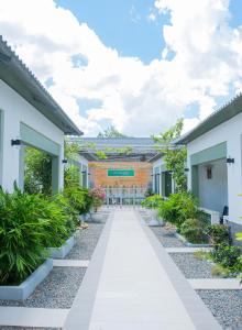 a walkway in front of a building at Nine Homestay in Can Tho