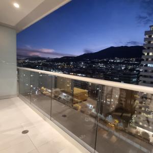 a view of the city from the balcony of a building at Suite Martina 2 Personas Quito in Quito