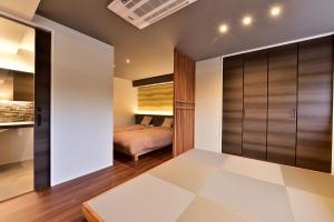 Postel nebo postele na pokoji v ubytování Shiga Grand Hotel