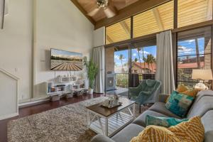 a living room with a couch and a tv at Luana Kai Loft C308 BY Betterstay in Kihei