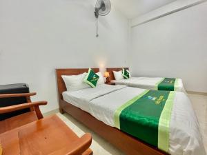 Postel nebo postele na pokoji v ubytování Minh Phương Hotel - Khách sạn Thủ Dầu Một Bình Dương