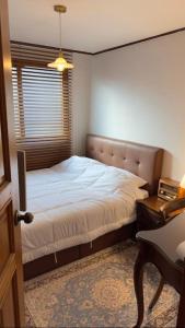 Postel nebo postele na pokoji v ubytování Salon de Hannam, Hanriver View, Itaewon nearhear