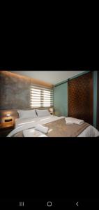 Uma cama ou camas num quarto em Hotel Flaer