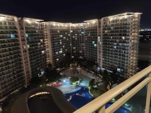 an aerial view of a large building at night at The Bahamas & Maldives Suites at Azure Residences near Manila Airport in Manila