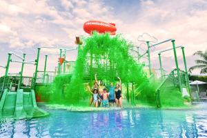 a group of people standing in front of a water park at Nickelodeon Hotels & Resorts Punta Cana - Gourmet All Inclusive by Karisma in Punta Cana