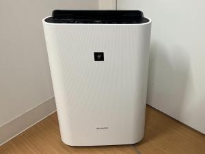 a white refrigerator sitting next to a wall at Vessel Inn Shinsaibashi in Osaka +103 photos