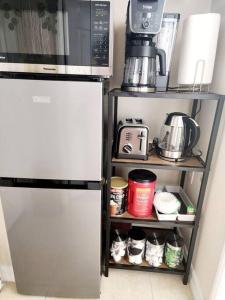 a kitchen with a refrigerator and a microwave at Beautiful All Private GuestSuite in Lancaster