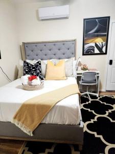 a bedroom with a large bed and a desk at Beautiful All Private GuestSuite in Lancaster
