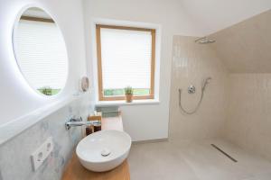 a bathroom with a white toilet and a sink at Naturparkbauernhof Pöltl in Pöllau