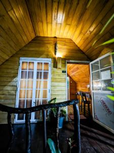 a cabin with a wooden ceiling and a window at The Emerald Guest House & Villa in Unawatuna +45 photos