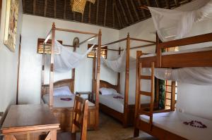 Postel nebo postele na pokoji v ubytování Lui Ushongo Beach House