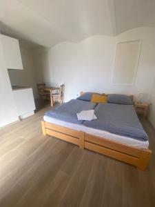 a bedroom with a large bed in a room at Na domečku in Bořetice