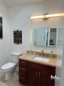 a bathroom with a toilet and a sink at Ocean Front Getaway in La Selva Beach in La Selva Beach