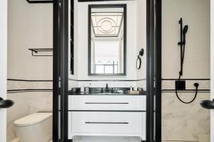 a bathroom with a sink and a mirror at OPARTMENT（远东饭店） in Shanghai