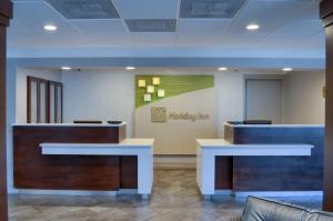 a lobby of a hospital with a waiting room at Holiday Inn Mobile West I-10, an IHG Hotel in Tillmans Corner