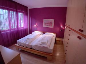 Postel nebo postele na pokoji v ubytování Andreis Apartments