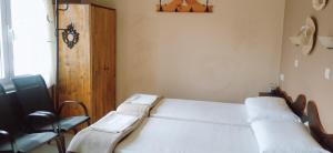 a hospital room with a bed and a chair at Lassithi Plateau Panoramic View Studios Apts Maria Rea in Agios Georgios