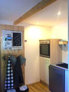 a kitchen with a sink and a stove top oven at Ferienwohnung - Michaelas HUUS - zwischen den Meeren, Trappenkamp in Trappenkamp