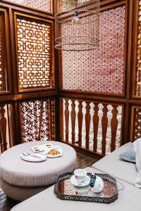 a room with two tables and a table with plates and cups at Lesic Dimitri Palace in Korčula