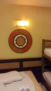 a room with a clock on the wall at Hotel Navegantes Beach in Fortaleza