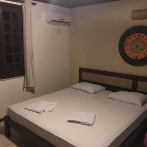 Giường trong phòng chung tại Hotel Navegantes Beach