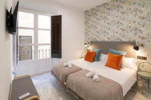 Granadi Apartamentos客房内的一张或多张床位