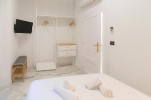 Granadi Apartamentos客房内的一张或多张床位