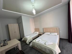 Postel nebo postele na pokoji v ubytování Guest House 99