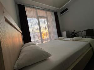 Postel nebo postele na pokoji v ubytování Guest House 99