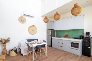 a kitchen with a table and chairs in a room at A12 - Private Villa in Seminyak - Big Pool - ALL NEW in Seminyak