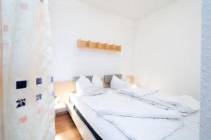 Postel nebo postele na pokoji v ubytování Grömitz-Center Whg 7 + 15 fotografií