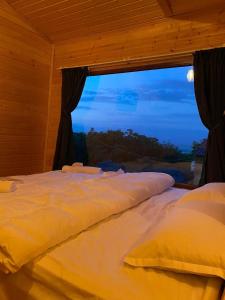 Voodi või voodid majutusasutuse Villaggio Mirzaani Resort toas