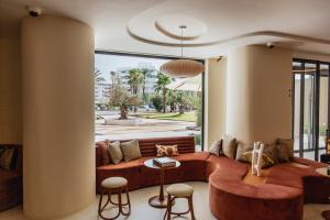 a living room with a couch and a table at Pacha Hotel in Ibiza Town