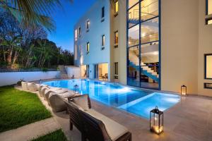 a swimming pool in the backyard of a house at Themis Luxury Private Villa Rhodes with Private Pool in Ialysos