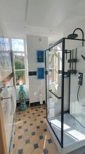 a bathroom with a glass shower and a toilet at Studio Nieuwland in Alkmaar