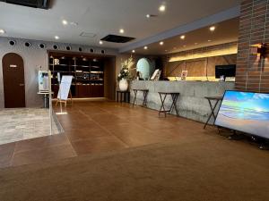 Sjónvarps- og/eða afþreyingartæki á Atami Onsen Hotel Yume Iroha