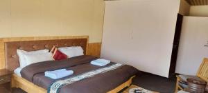Postel nebo postele na pokoji v ubytování Norling Cozy Cottages + 14 fotografií